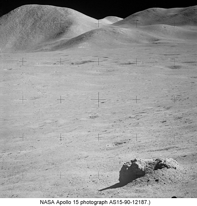 Apollo 15 photo showing boulder and soil.